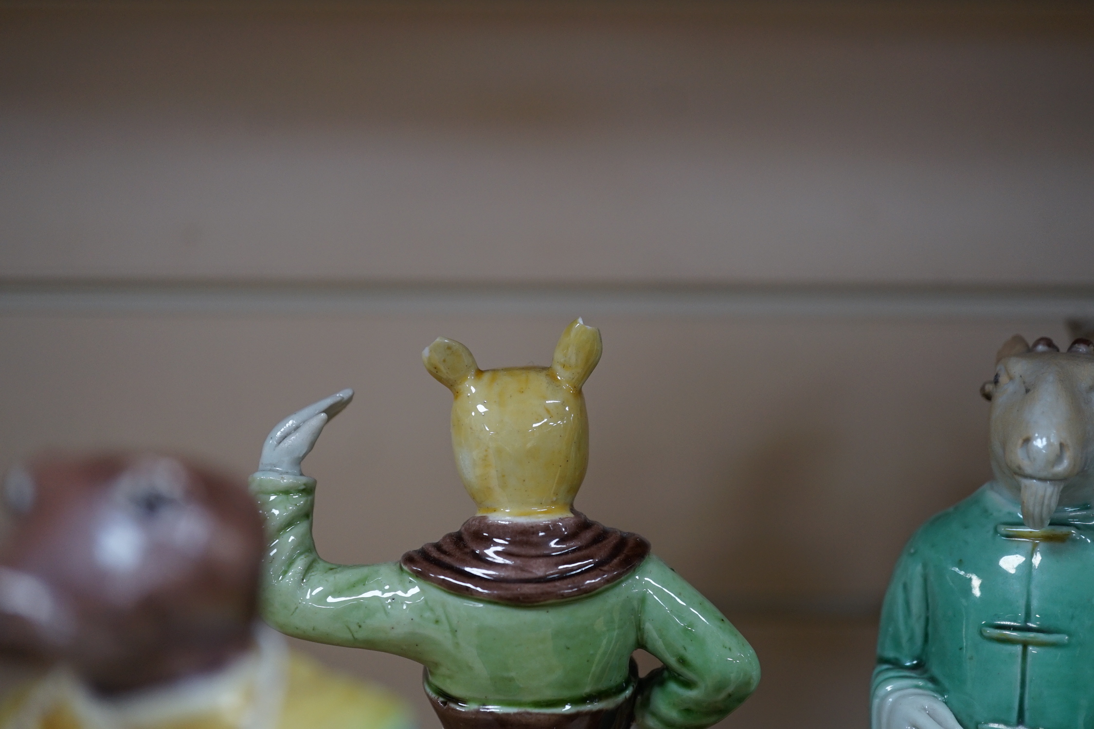 Ten Chinese Sancai glazed biscuit animal headed figures, tallest 17cm